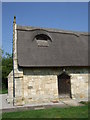 Detail from thatched roof and doorway at St Peter