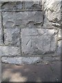 Benchmark on the boundary wall of Plas Gogarth on Church Walks, Llandudno