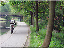 SK5639 : Nottingham Canal: cycling commuter by John Sutton
