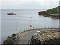 Timber barge and tug at Brodick