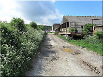 SU8716 : Approaching Hill Barn and Manor Farm by Chris Heaton