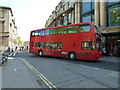 Bus turning from Magdalen Street East onto Broad Street