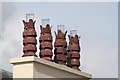 four matching chimney pots