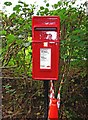 Modern post mounted postbox at Coppicegate