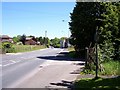 Public footpath sign on the A58 at Hart Common