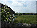 Old barn, field and pylons