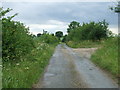 TL7049 : Footpath off country lane by Keith Evans