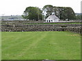 View across fields and stone walls to the Aughnahoory Orange Hall