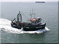 TQ8983 : Fishing boat passes close to Southend Pier by Roger Cornfoot