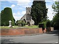 SP2069 : Brick retaining wall, Rowington churchyard by Robin Stott