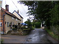 TM4566 : The road in front of Eels Foot Public House by Geographer