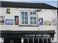 Old adverts on Post Office wall at Fulstow