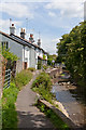 River Meon flows past Eames Cottages, East Meon