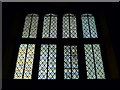 Windows above the chapel door at Sackville College