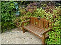 Memorial seat and statue in grounds of Chequer Mead Theatre & Arts Centre