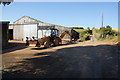 A digger in action at Motherhill Farm