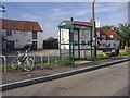 Bus stop in front of The Fox pub, Tiddington