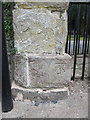 Bench mark  by the priory gate