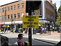 "Cyclists must stop at red lights" notice