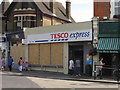 Ealing shops boarded up after riots