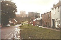 NU1834 : Bamburgh castle and village in 1984 by John Baker