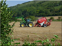 TQ2511 : Tractor at work in stubble field at Fulking (1) by Shazz