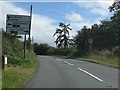 Sign and milepost on the B4202 approaching Clows Top