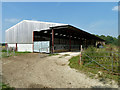 TQ0922 : Cattle shed, Wood Barn Farm by Robin Webster