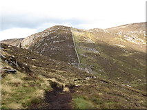 J3228 : The Mourne Wall ascending Slievenaglogh by Eric Jones