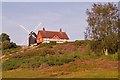 TQ2350 : Reigate Heath Windmill and Reigate Heath Golf Club clubhouse by Ian Capper