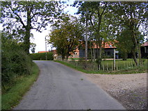 TM2256 : Road near to Moat Farm by Geographer