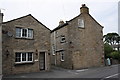 Houses beside the main road through West Witton