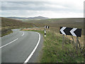 SJ9968 : Double bend, A54 west of Cut-thorn Hill  by Robin Stott