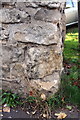 Remains of old benchmark at north end of Park Crescent