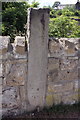 Benchmark on gatepost beside canal towpath