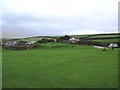 Grassy area at Willingcott Cross, with entrance to Willingcott Golf Club