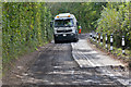 Sweeping up after road planing in Hensting Lane