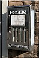 NT9261 : An old cigarette machine at Ayton by Walter Baxter