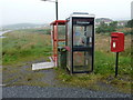 HU4235 : Quarff: postbox № ZE2 64 and phone by Chris Downer