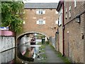 Narrowboat passing under the Straddle Warehouse