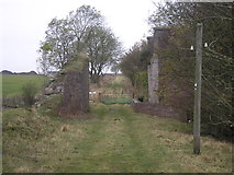 NO5007 : Farm track to dismantled railway bridge by Sandy Gemmill