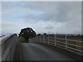SY1098 : Footpath and farm track bridge over A30  by David Smith
