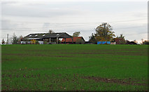 TQ8899 : Looking over fields towards farm buildings by Roger Jones
