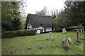 Thatched cottage in the churchyard