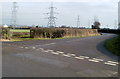 Pylons viewed from a road junction near Magorpill Farm