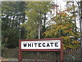 Former station sign preserved beside Whitegate Way