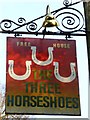 The sign at "The Three Horseshoes" public house