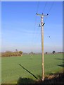 SP3967 : Power lines north of dismantled railway by David P Howard