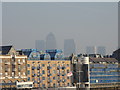 A hazy view of Canary Wharf from Tower Bridge