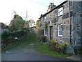 Grassy track beside a cottage in Rowen